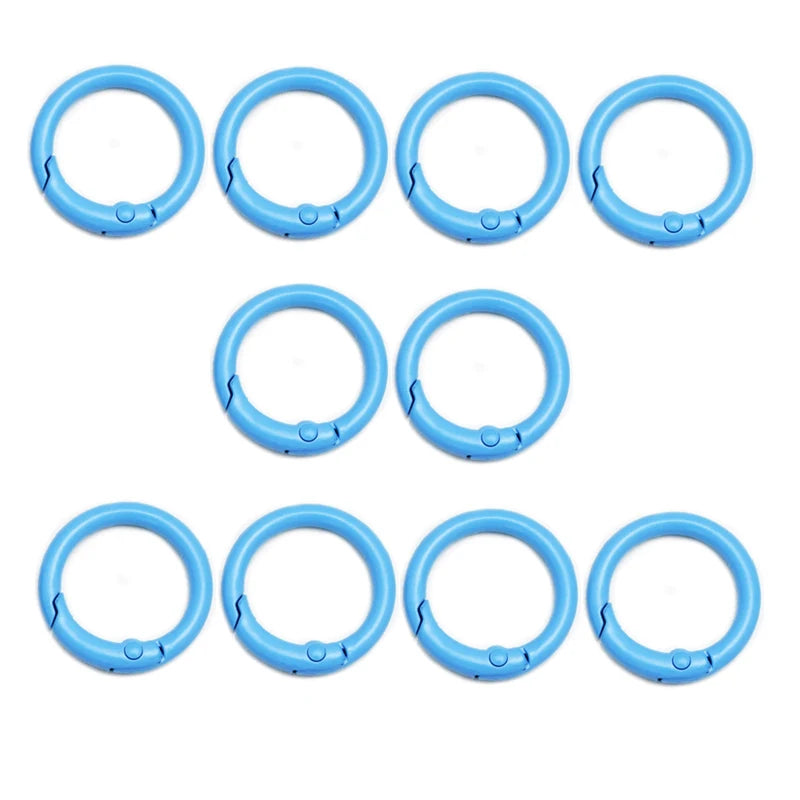 A set of eight blue alloy snap hook keychain clips arranged in two rows.