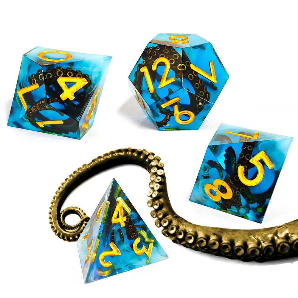 A set of resin dice shaped like an octopus, featuring blue and black resin with yellow numbers for RPG games.
