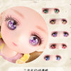 A close-up of a pink silicone doll with detailed eyes showing various color and style options.