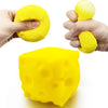 Hands are squeezing a bright yellow, squishy cheese-shaped fidget toy.