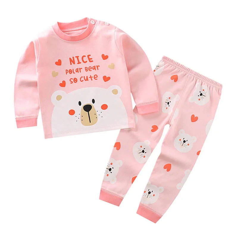 Pink kids pajama set for a baby featuring a polar bear design with hearts