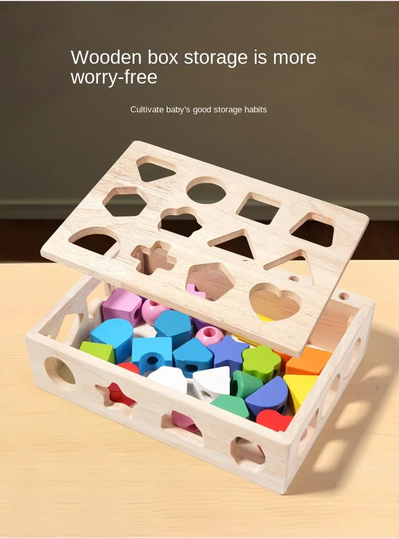 A wooden box storage organizer with various holes and shapes for sorting toys, placed on a light wood surface.