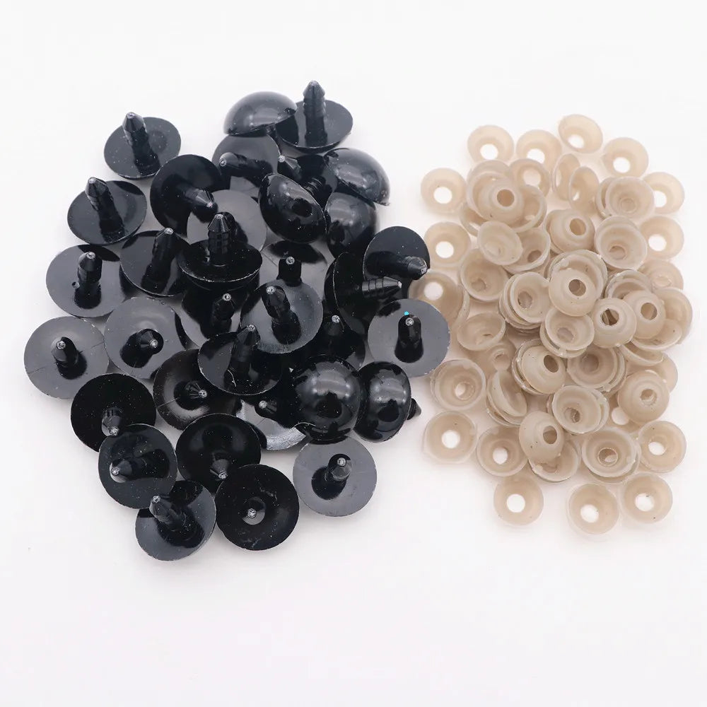 A collection of black and beige plastic safety eyes with locking washers for amigurumi projects.