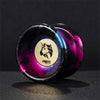 A close-up of a professional metal yo-yo with a purple and black marbled finish featuring an Ares logo.