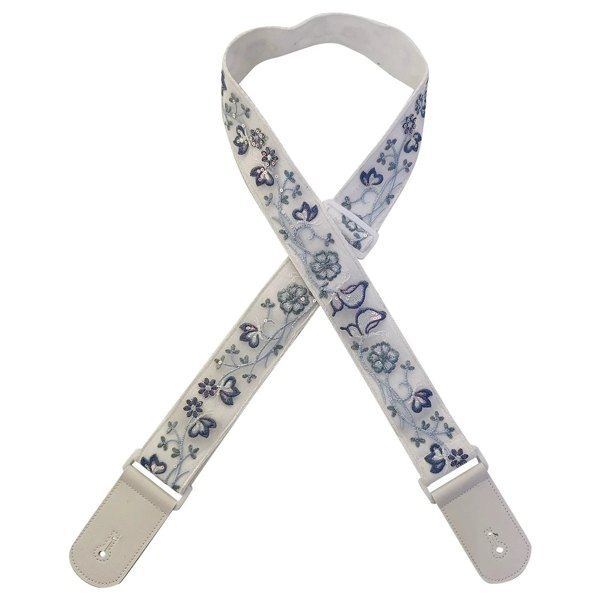 A beige woven guitar strap with blue floral patterns and leather accents, shown diagonally.