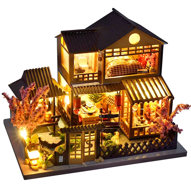 A detailed wooden dollhouse with furniture and interior LED lighting, featuring a pitched roof and decorative elements.