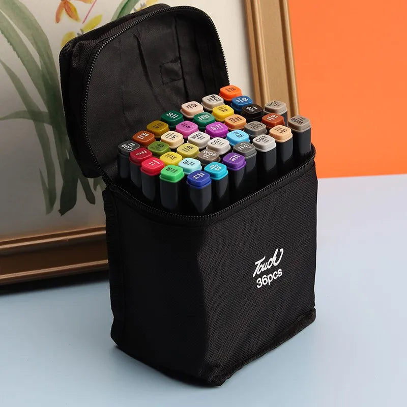 A black zippered pouch containing a set of alcohol art markers with various colored tips.