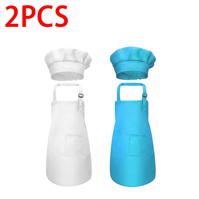 A set of two kids chef aprons and hats, one white and one blue.