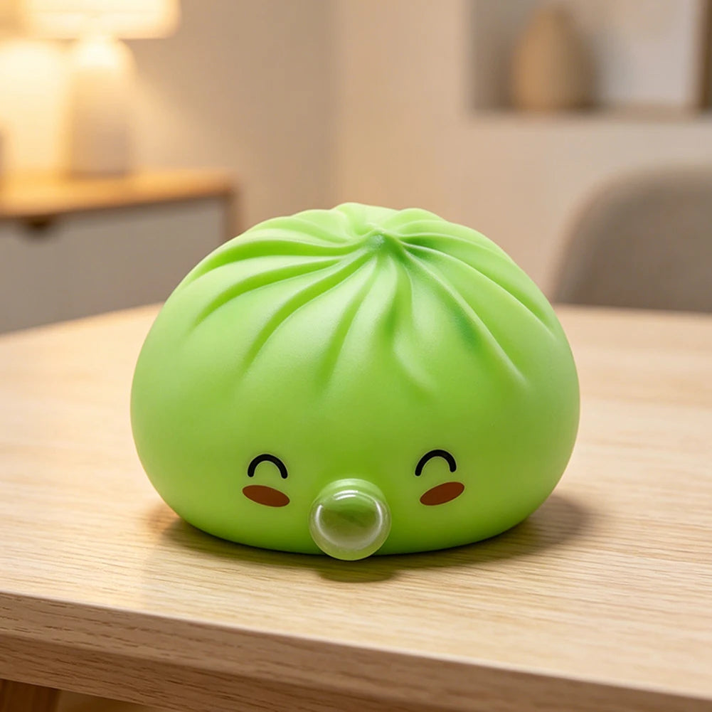 A bright lime green squishy toy shaped like a dumpling with cute eyes resting on a wooden surface.
