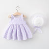 A lavender floral print baby girl summer dress and sunhat set with a purple bow detail.