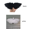 A pair of black mini feather angel wings shown against a light gray background.