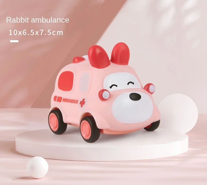 A pink rabbit ambulance toy car with a white face and red accents is displayed on a white stand.