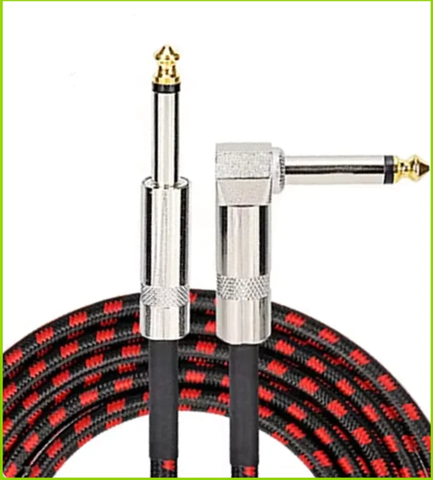A professional instrument cable with a right-angle connector and black insulated leads is shown against a background of coile