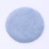 A round, light blue, fluffy miniature carpet mat for dollhouse decor.