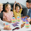 A family is shown decorating with a 6-pack of colorful articulated dragon eggs for decor.