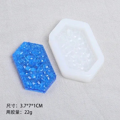 A clear silicone resin mold set featuring an irregular white mold and a blue faceted mold for DIY jewelry making