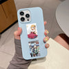 A light blue smartphone case featuring K-ON! anime stickers, including a guitar girl and characters from the series.