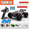 A black and pink brushless 4WD monster truck RC car with high-speed features and metal shock absorbers.