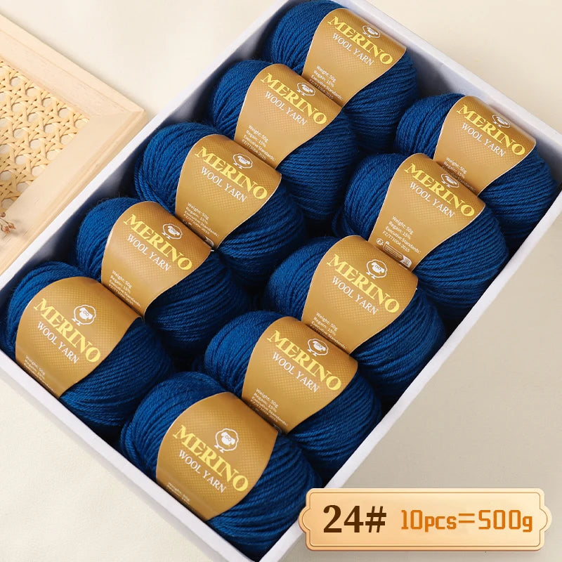 Box of 10 skeins of Merino wool yarn in blue with gold labels for knitting