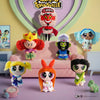 A collection of Powerpuff Girls figures, including Blossom and Bubbles, displayed in a colorful scene.