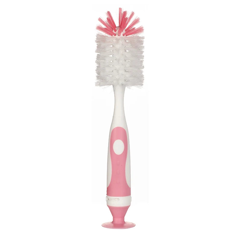 A pink and white 2-in-1 baby bottle cleaning brush set with a suction stand.
