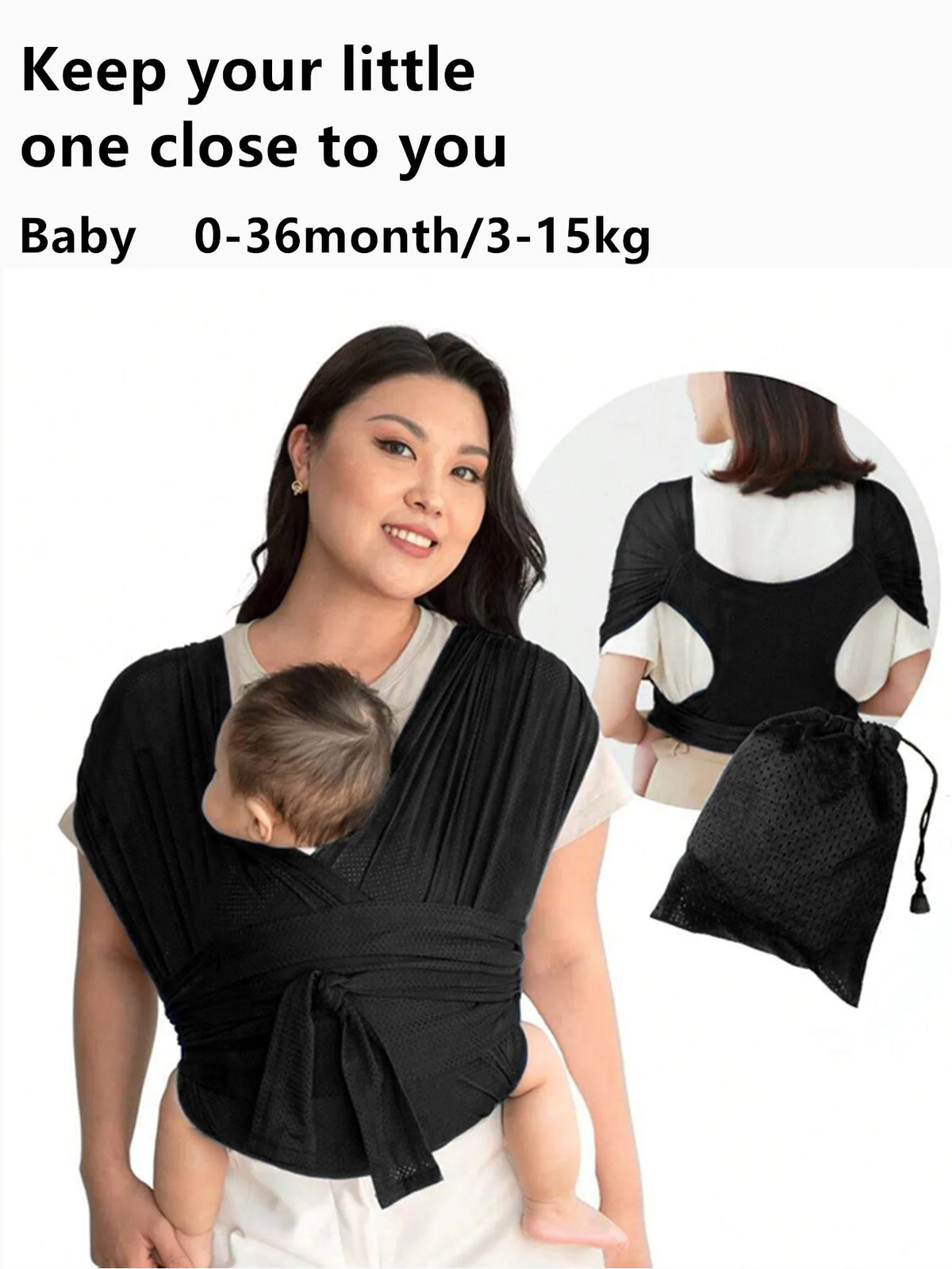 A woman is wearing a black X-shaped baby sling carrier while holding a baby.