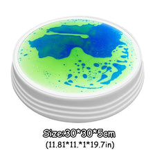 A round mat with a vibrant green and blue liquid or gel, used as an interactive LED balance stone for kids.