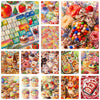 A collection of diamond painting kits featuring various sweet desserts like cupcakes, watermelon, and strawberry art.