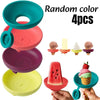Four random colored silicone popsicle holders for kids displayed on a hand.