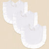 A pack of three white pure cotton muslin baby bibs with absorbent design