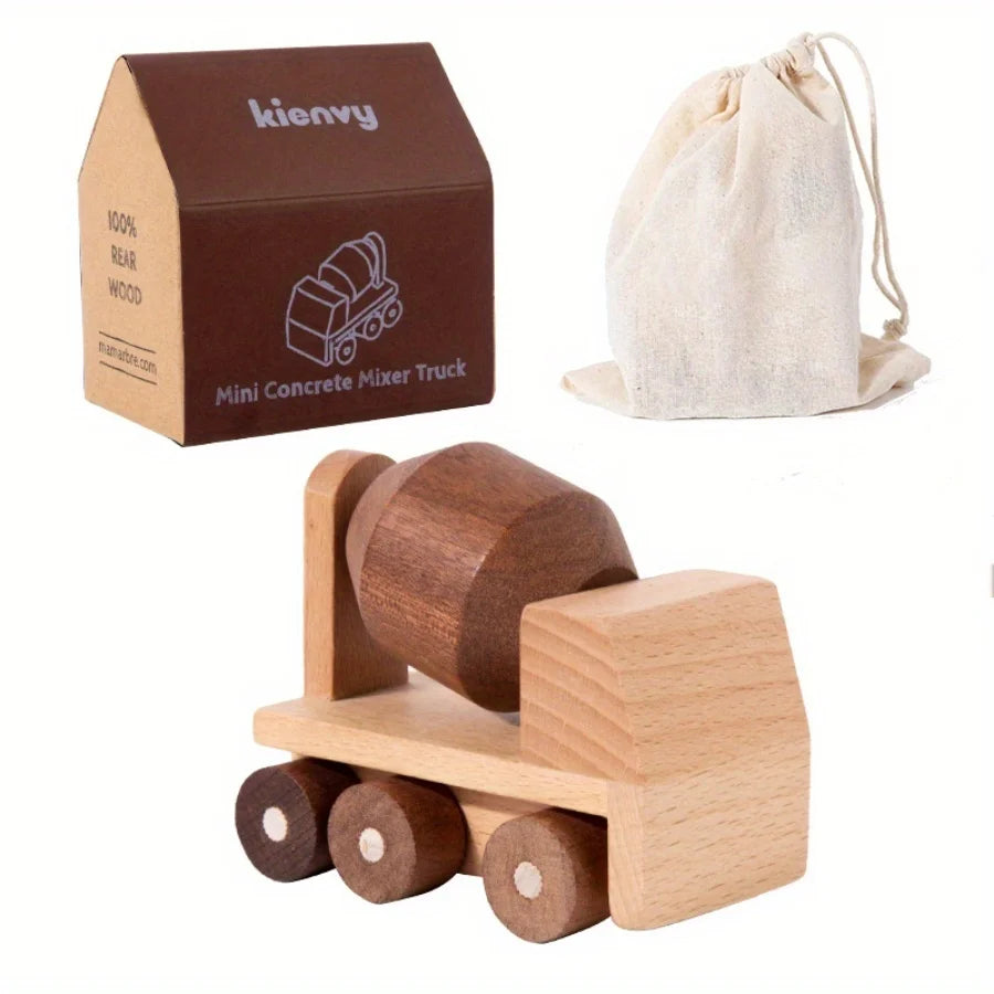 Une boîte marron étiquetée kienvy contenant un mini camion béton et un jeu de rouleaux en bois.