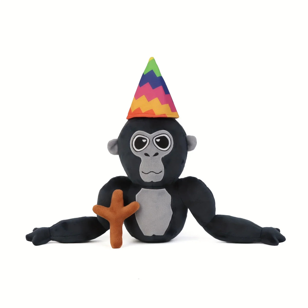 A black gorilla plush toy with a multicolored conical hat.