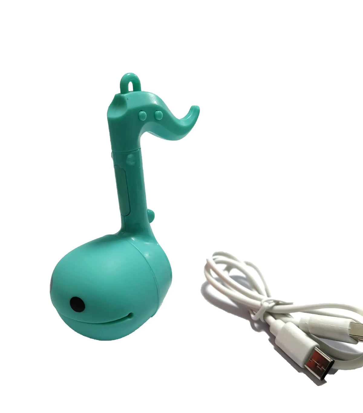 A teal otamatone mini electronic musical instrument toy with a curved neck and attached white cord.
