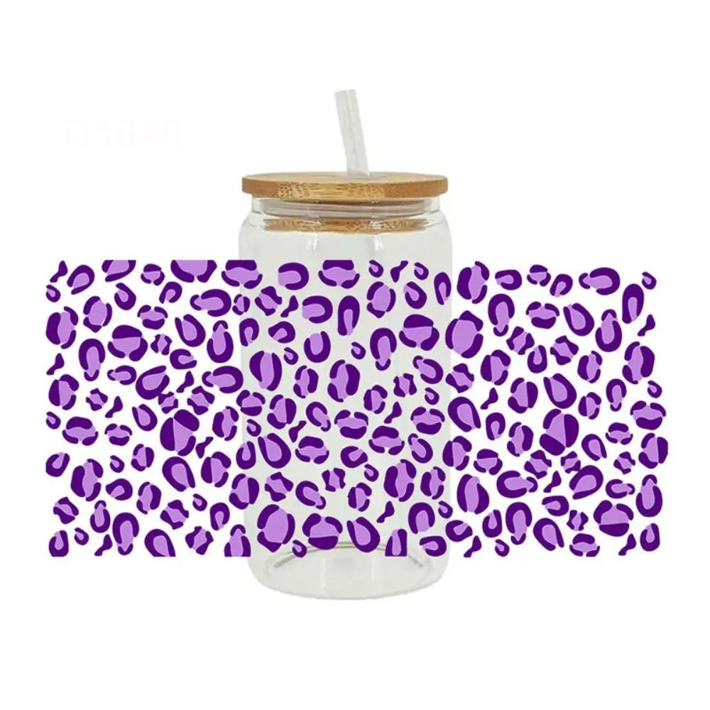 Clear glass jar with a lid and a straw, wrapped in purple leopard print transfer stickers.