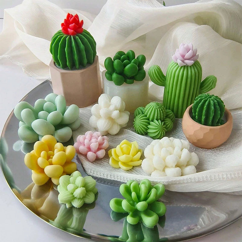 A collection of green and pink silicone cactus and succulent molds for crafting candles, soap, and plaster