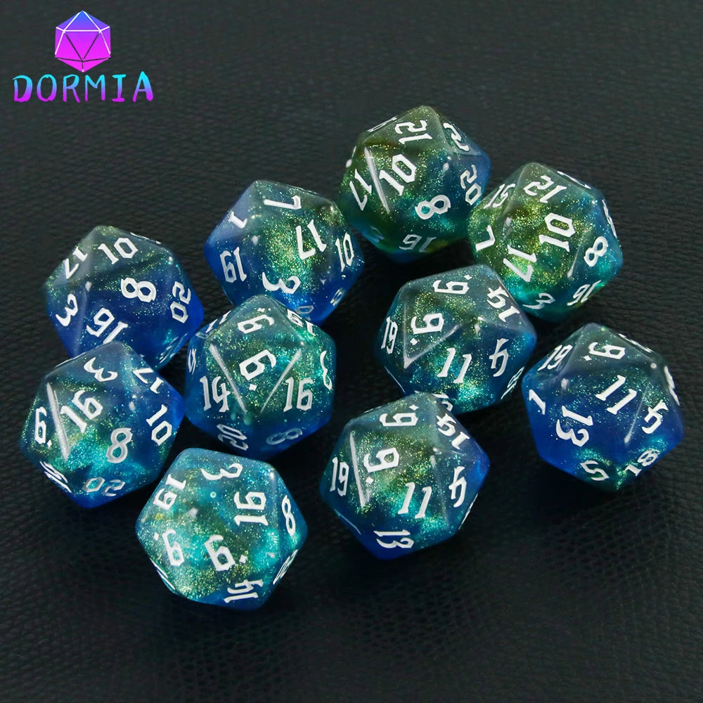 A collection of ten glittery blue and green polyhedral dice set on a dark surface.