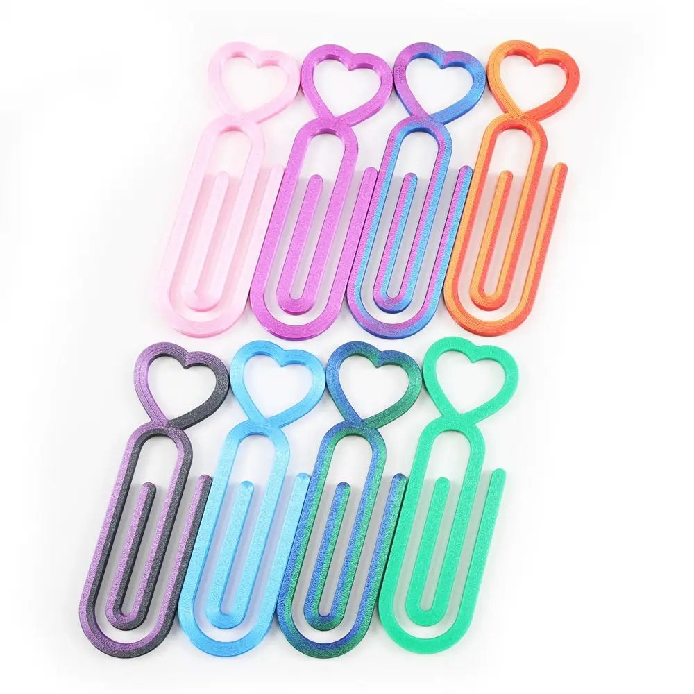 A collection of heart-shaped canvas clips in various pastel colors including pink, purple, blue, and orange.