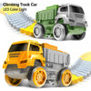 A green climbing track car and an orange dump truck are shown with a yellow LED light track set.