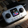 A silver IRIN instrument processor with a digital display and controls rests on a guitar neck.