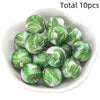 A collection of ten green and pink marbled silicone beads for DIY jewelry making