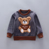 A gray fleece sweater with a brown collar and a cartoon bear design featuring the text THISISNOT ABCY.