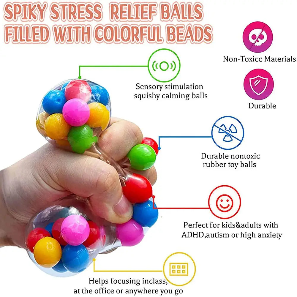 A hand holds a colorful bead stress ball toy designed for sensory stimulation and calming.