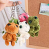 A set of adorable turtle plush keyrings with colorful charms hanging from chains.