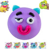 A purple moldable dog face squishy toy with black eyes and a pink tongue, shown next to two green squishy toys.