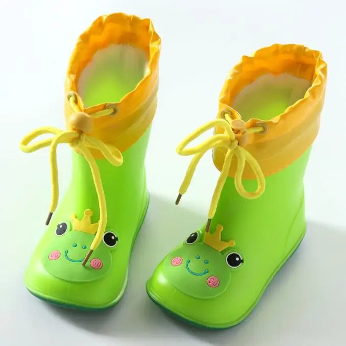 A pair of bright lime green rain boots with yellow trim and a cute frog design.