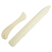A white plastic bone folder set for paper creasing and folding crafts, showing the tool and its handle.