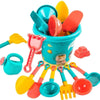A collection of 18 plastic beach sand toys including shovels, scoops, and other tools in various colors like yellow, orange, 