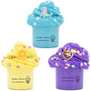 Two jars of butter slime are shown, one light blue with a dinosaur design and one purple with a cake design.