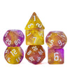 A set of seven translucent polyhedral dice in yellow, purple, and amber colors.
