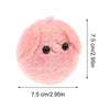 A pink fluffy plush pig with black eyes and a pink nose, used as a keychain or bag charm.